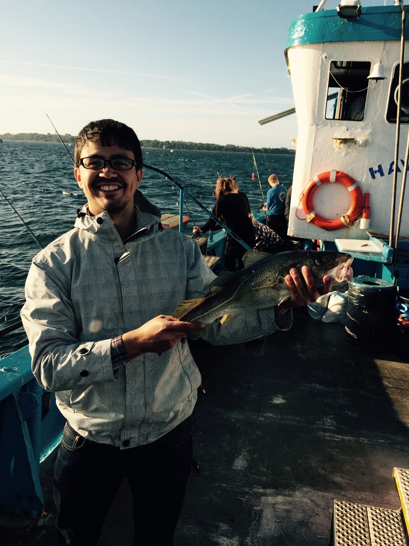 group member catching big fish