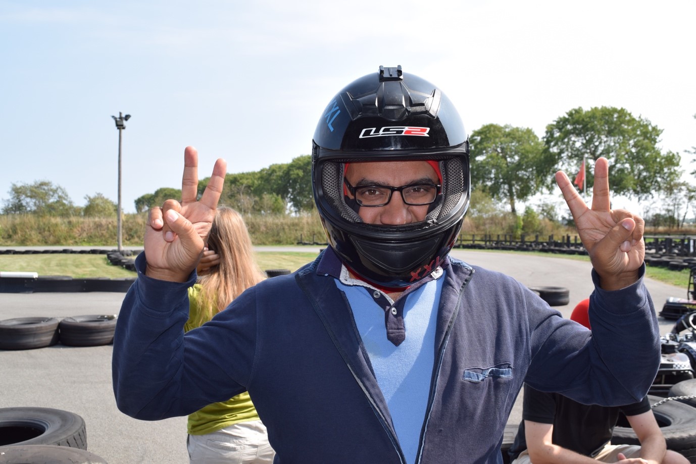 group member cheering with motor helmet