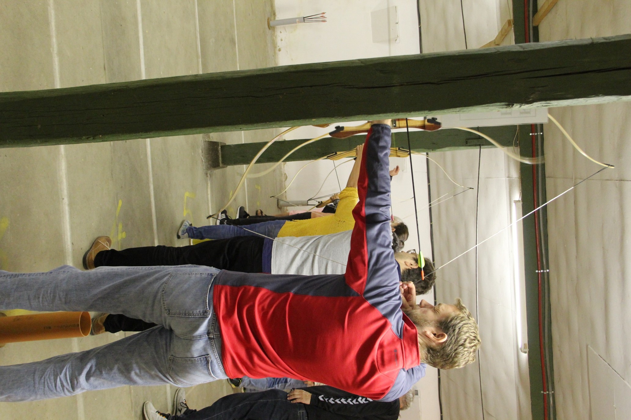 group members practicing archery