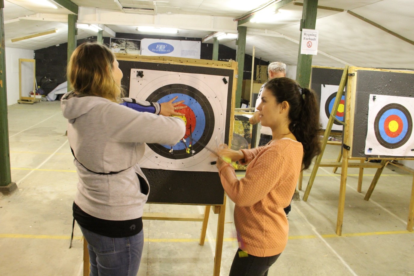 group members retrieving arrows